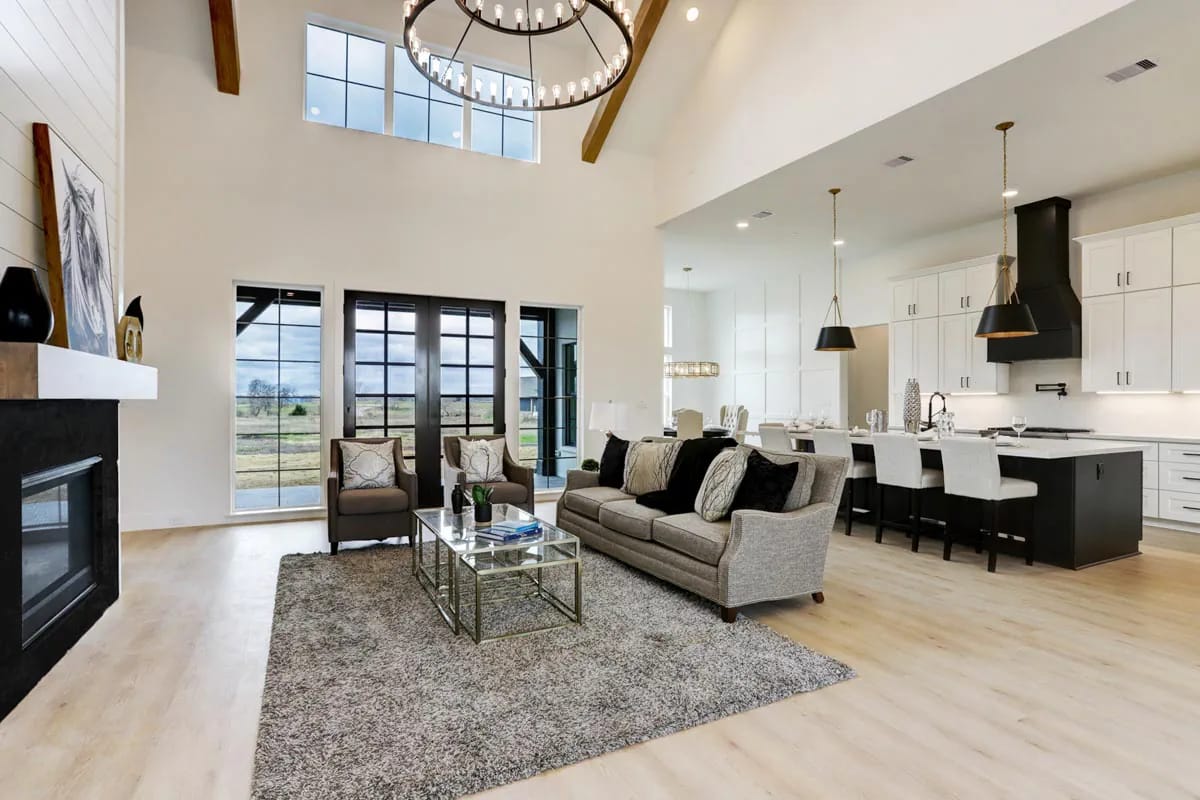 4-Bedroom Modern Farmhouse House Plan with a Vaulted Great Room and Bonus Room (2,877 Sq. Ft. Floor Plan) 7 a shiplap chimney breast straight up the great room vault 1