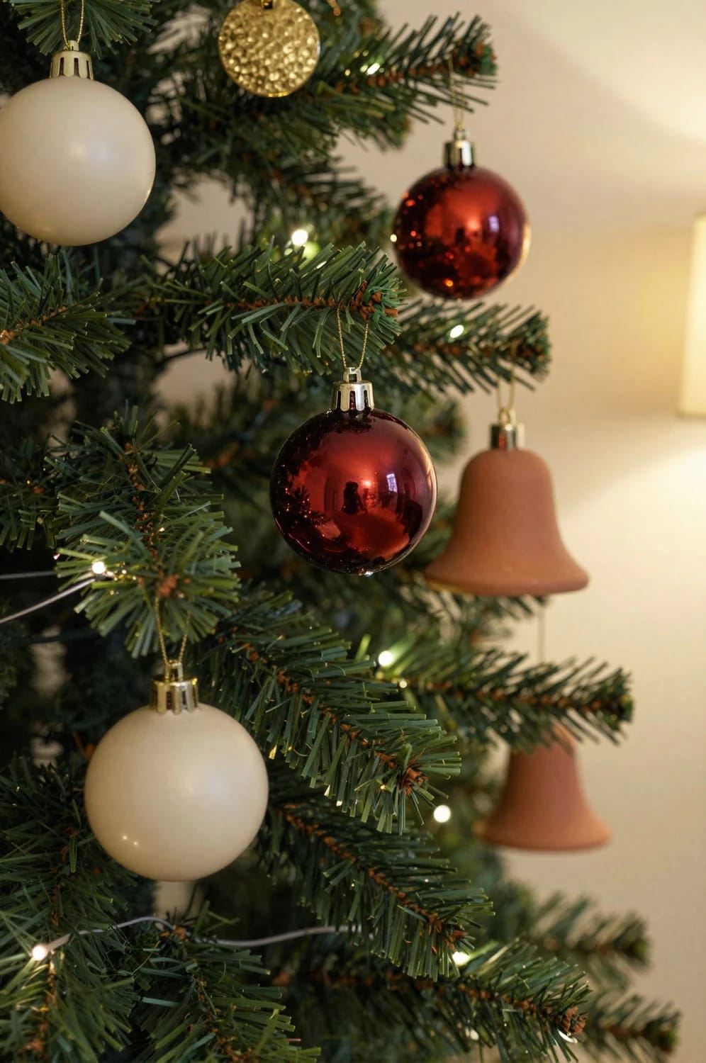Small Apartment Christmas Tree Ideas for a Slim or Tabletop Tree That Doesn't Look Like a Compromise 12 big ornaments on a narrow tree, and about half as many 1