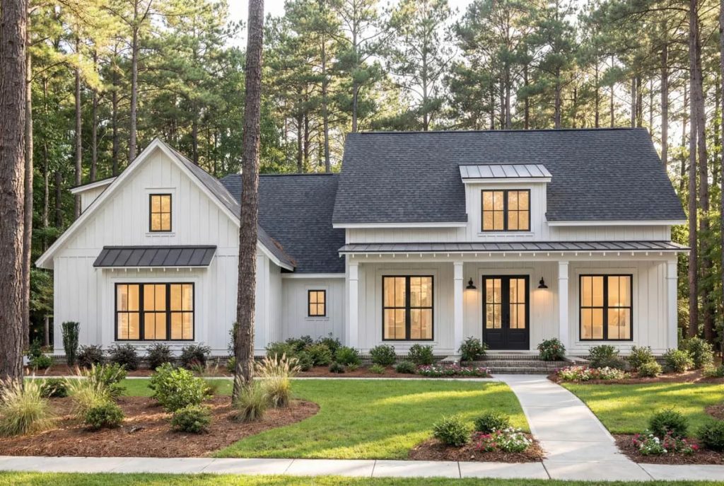 Modern farmhouse with white board-and-batten siding, black windows, and a large covered front porch.