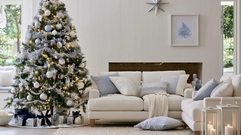 9 Monochrome Christmas Tree Themes for a Single-Color Tree That Still Looks Finished 1 A single-color monochrome Christmas tree decorated with white and silver ornaments, garlands, and lights stands in a stylish living room with neutral-toned furniture and wrapped gifts beneath the tree, illustrating a finished monochrome Christmas tree theme.