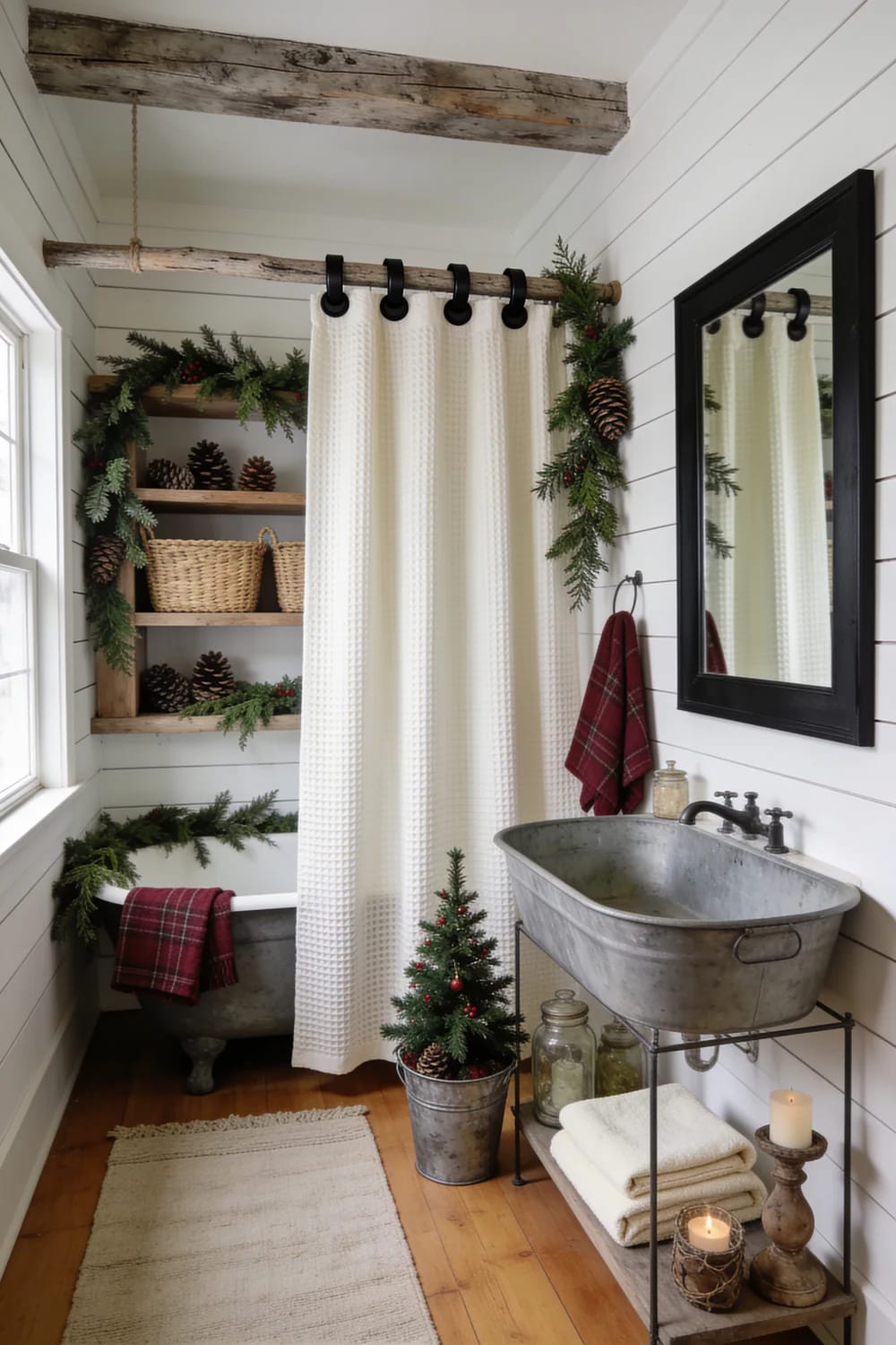 Farmhouse Christmas Bathroom Waffle Shower Curtain Farmhouse Christmas bathroom featuring a white waffle-weave shower curtain, greenery with pinecones, red plaid towels, a galvanized metal tub sink, rustic shelves, and a small potted Christmas tree