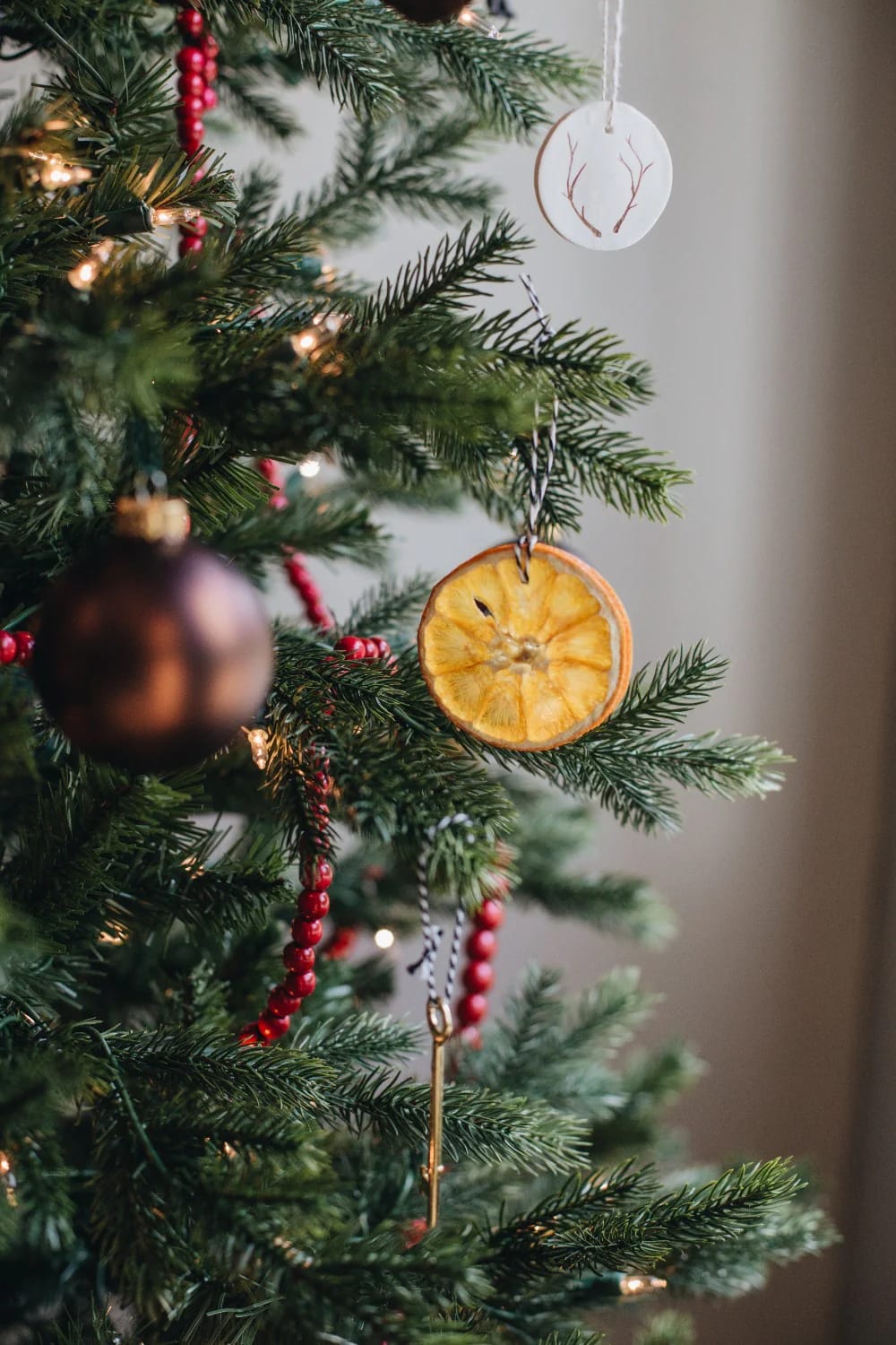 hang the tree slices on linen thread and brass hooks, not red ribbon 1