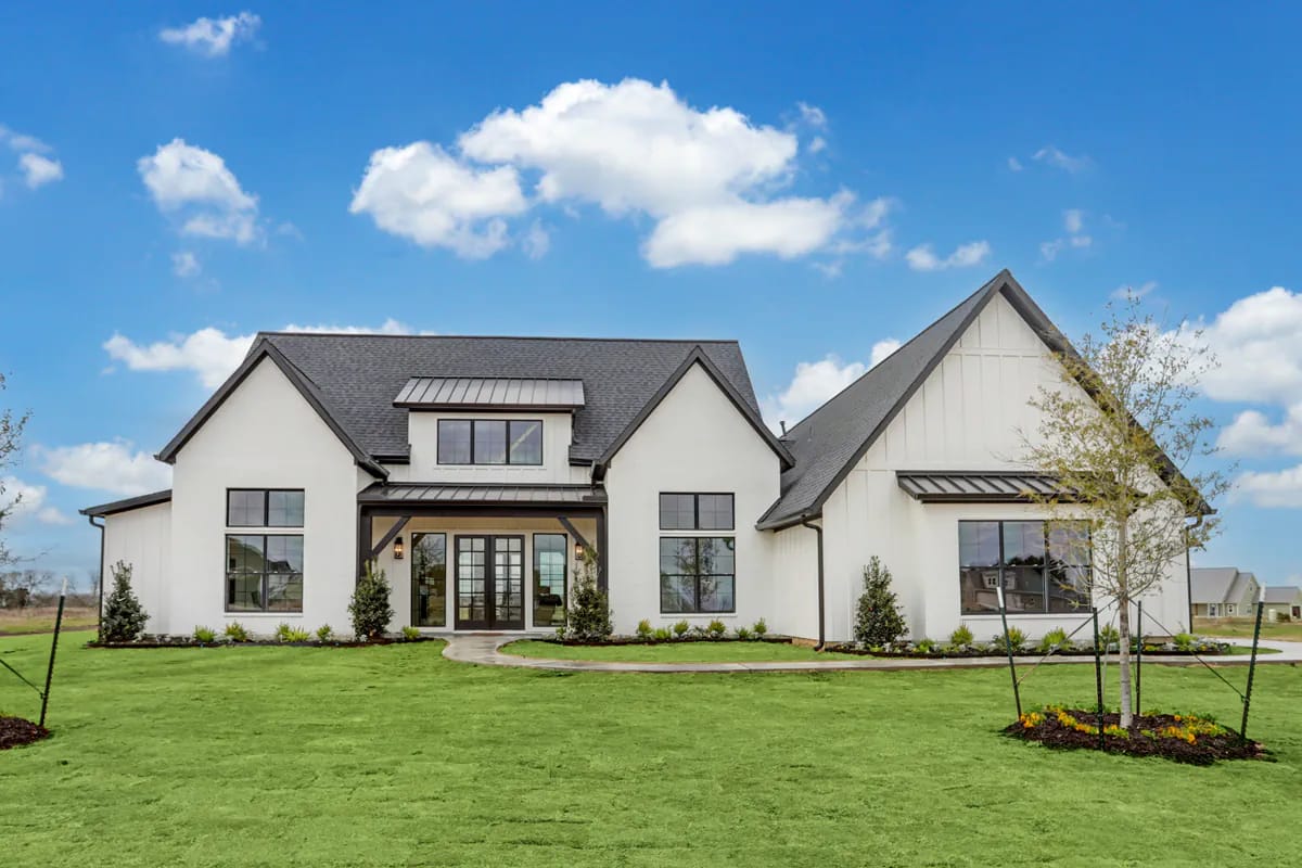 4-Bedroom Modern Farmhouse House Plan with a Vaulted Great Room and Bonus Room (2,877 Sq. Ft. Floor Plan) 16 one elevation, two skins: tumbled brick or all white 1