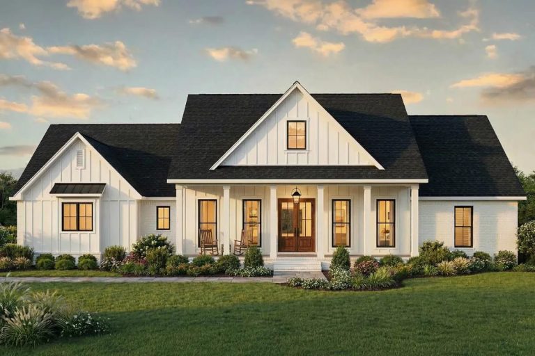 4-Bedroom Modern Farmhouse House Plan with Split Bedrooms and a 14-Foot Rear Grilling Porch (2,166 Sq. Ft. Floor Plan) 1 Modern farmhouse with white board-and-batten siding, front porch, and gable roof at sunset.