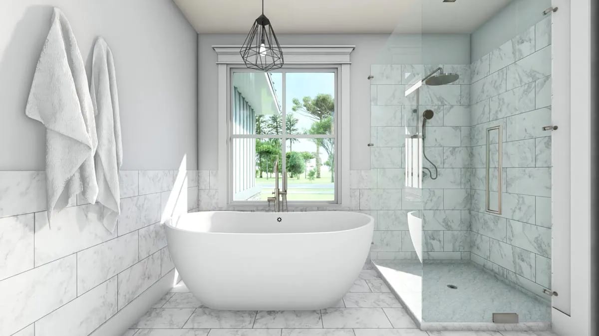Bright bathroom with freestanding tub, marble-look tile, and glass walk-in shower