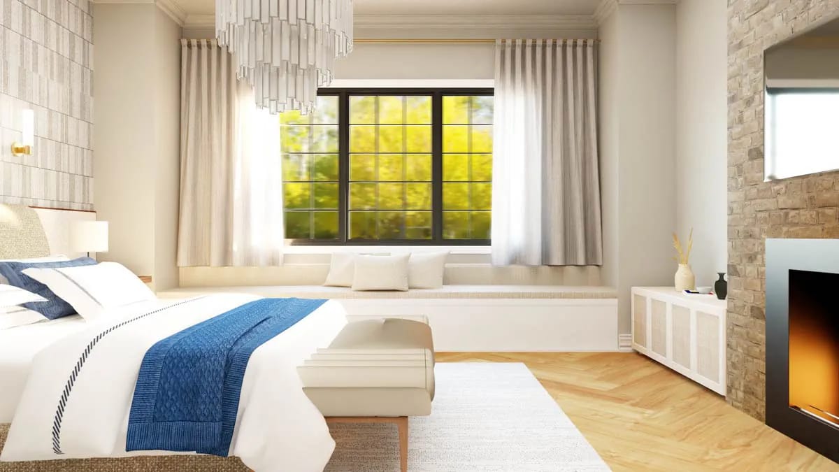 Bright, modern bedroom with a large window bench, stone fireplace, and blue-accented bedding Bright, modern bedroom with a large window bench, stone fireplace, and blue-accented bedding