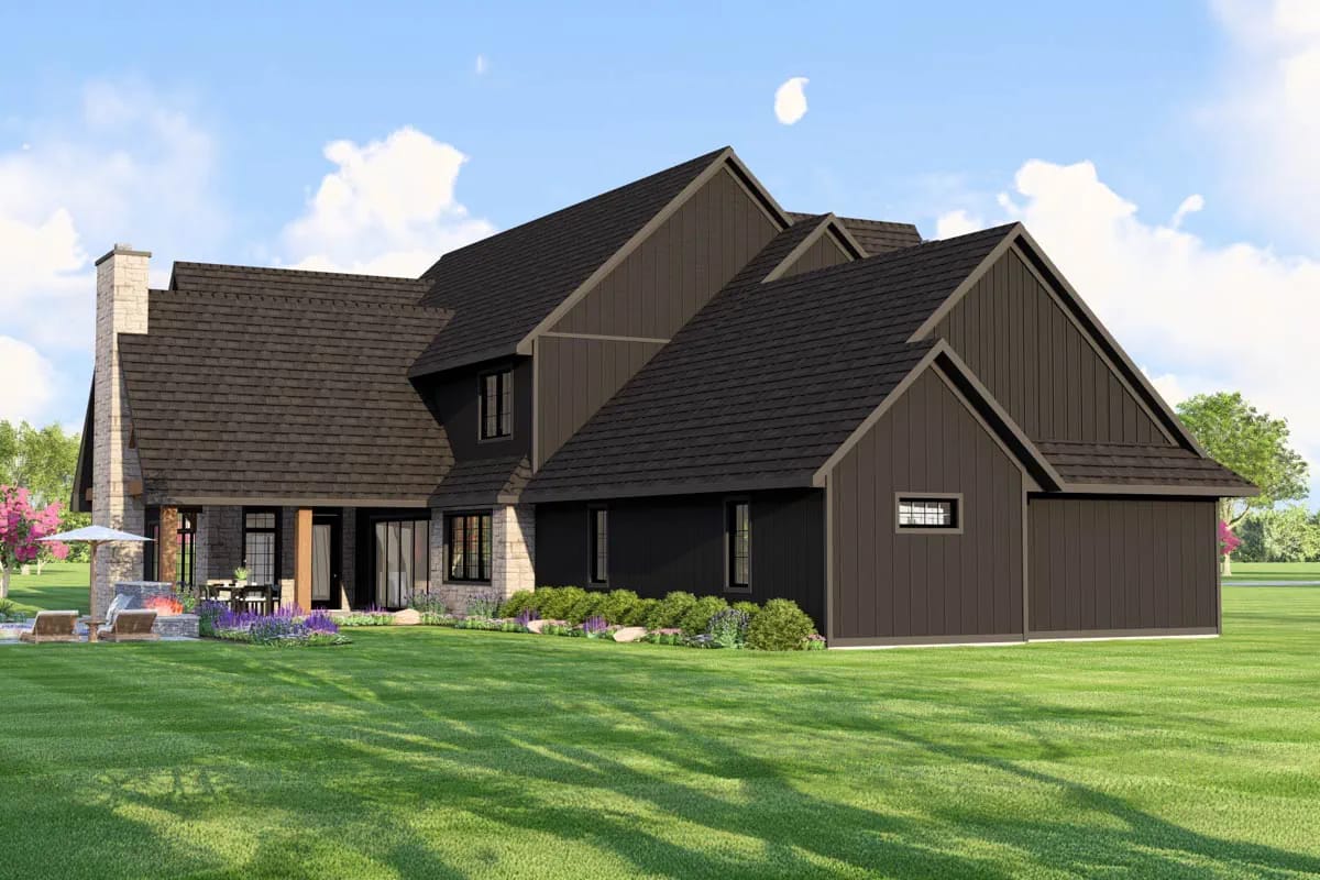 Modern farmhouse exterior with dark vertical siding, steep gable roofs, and stone accents. Modern farmhouse exterior with dark vertical siding, steep gable roofs, and stone accents.