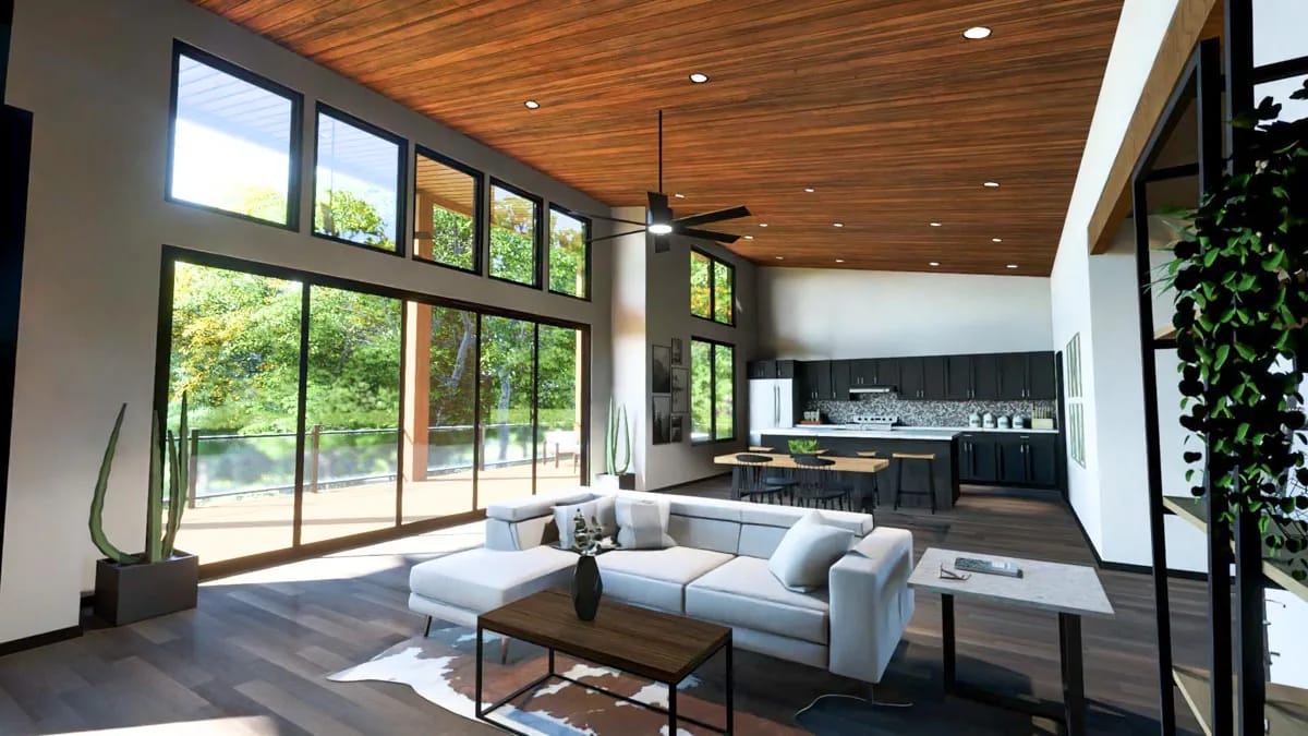 Modern open-plan great room with wood ceiling, tall windows, pale sectional, and dark kitchen cabinetry