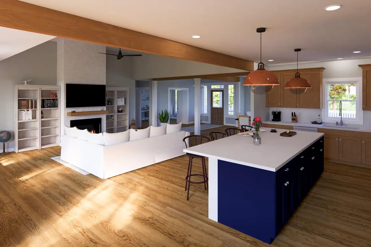 Open-concept kitchen and living room with blue island, wood cabinetry, fireplace, and exposed beam
