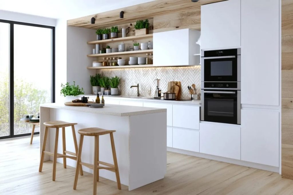 Lovely Harbor 27 Bright small apartment kitchen with a white island, two wooden stools, open shelves displaying dishes and plants, white cabinets, built-in ovens, and a tiled backsplash