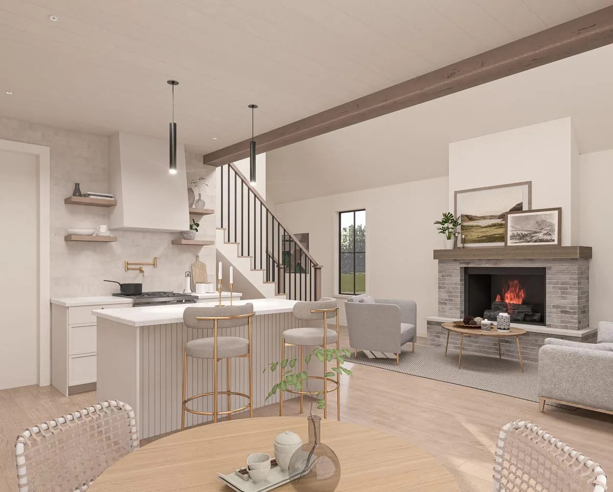 Contemporary open-plan kitchen and living room with fluted island, staircase, and gray masonry fireplace Contemporary open-plan kitchen and living room with fluted island, staircase, and gray masonry fireplace