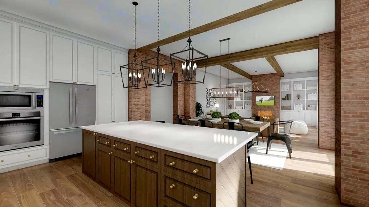 Open-plan kitchen and dining room with wood island, brick columns, exposed beams, and pendant lighting